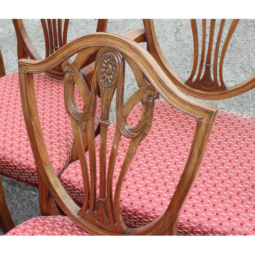 30 - A set of 10 19th century shield backed mahogany dining chairs (2 carver & 8 dining), with patterned ... 