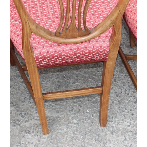 30 - A set of 10 19th century shield backed mahogany dining chairs (2 carver & 8 dining), with patterned ... 