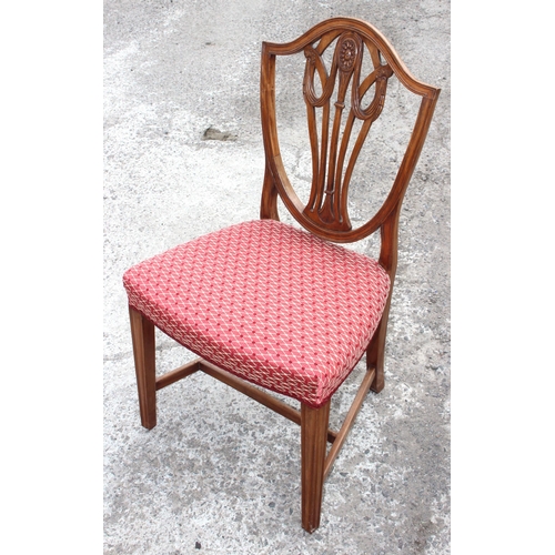 30 - A set of 10 19th century shield backed mahogany dining chairs (2 carver & 8 dining), with patterned ... 