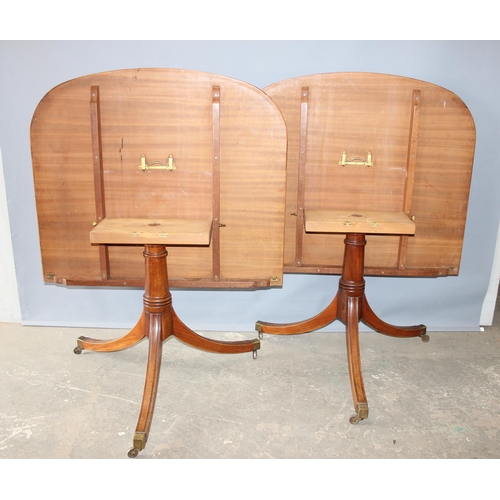 32 - An Edwardian mahogany pedestal tilt topped dining table with extra leaf, approx 230cm x 107cm inc ex... 