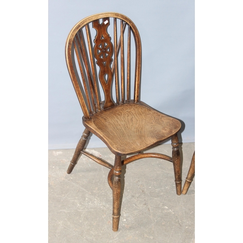 35 - A pair of vintage elm seated wheel back chairs