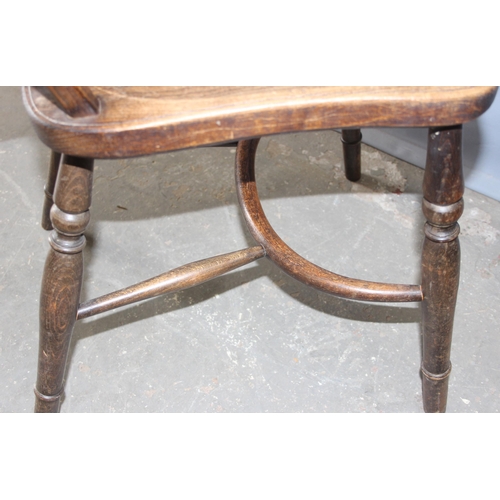 35 - A pair of vintage elm seated wheel back chairs