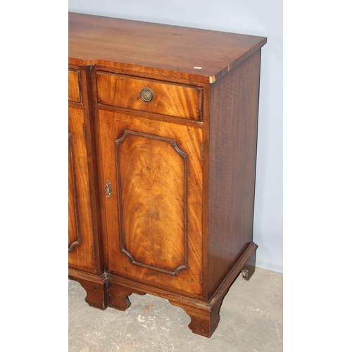 36 - An antique style mahogany breakfront sideboard with 4 drawers over 3 cupboards, approx 155cm wide