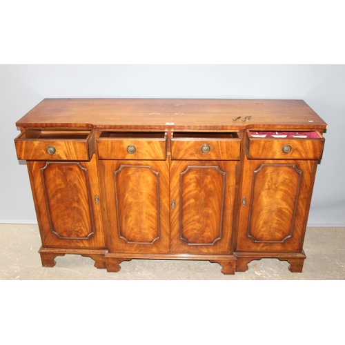 36 - An antique style mahogany breakfront sideboard with 4 drawers over 3 cupboards, approx 155cm wide