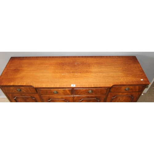 36 - An antique style mahogany breakfront sideboard with 4 drawers over 3 cupboards, approx 155cm wide