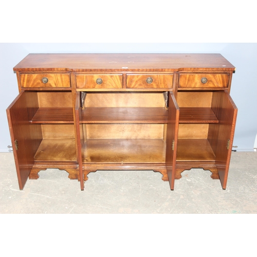 36 - An antique style mahogany breakfront sideboard with 4 drawers over 3 cupboards, approx 155cm wide