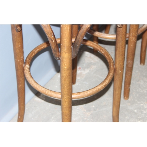 38 - A set of 4 vintage Thonet style bentwood stools with stuffed seats