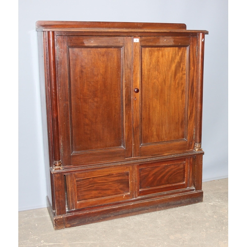 4 - A late 19th century mahogany hall cupboard with 2 shelves in the upper section over a lower cupboard... 