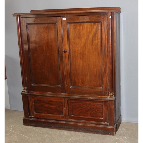 4 - A late 19th century mahogany hall cupboard with 2 shelves in the upper section over a lower cupboard... 