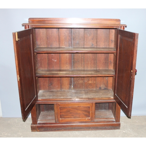 4 - A late 19th century mahogany hall cupboard with 2 shelves in the upper section over a lower cupboard... 