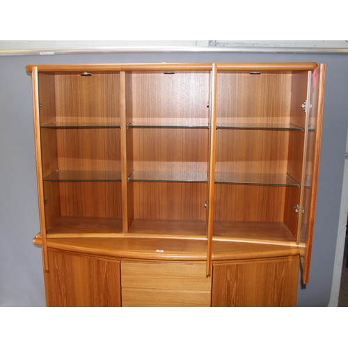 40 - A large Danish display cabinet by Preben Schou, 2 cupboards flanking 3 drawers and a glazed removabl... 