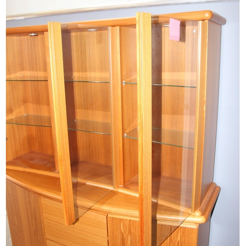 40 - A large Danish display cabinet by Preben Schou, 2 cupboards flanking 3 drawers and a glazed removabl... 