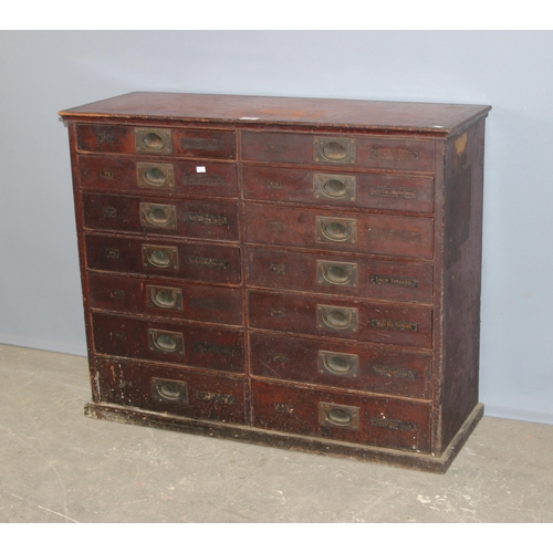 5 - A late Victorian mahogany haberdashery shop bank of fourteen drawers, each graduated drawer with flu... 