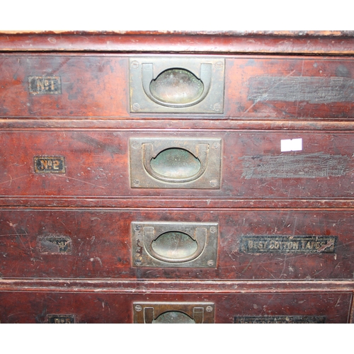 5 - A late Victorian mahogany haberdashery shop bank of fourteen drawers, each graduated drawer with flu... 