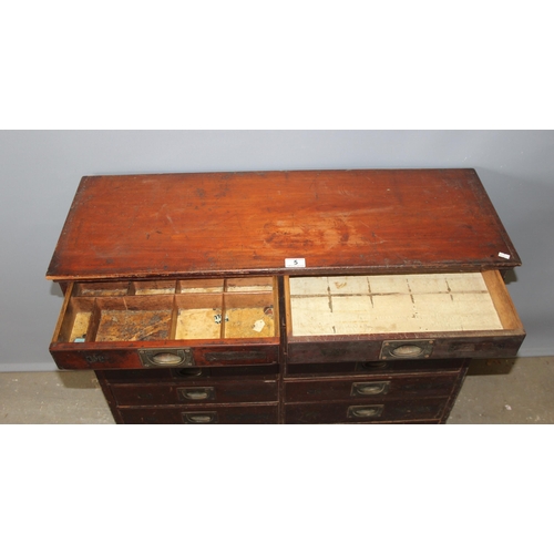 5 - A late Victorian mahogany haberdashery shop bank of fourteen drawers, each graduated drawer with flu... 