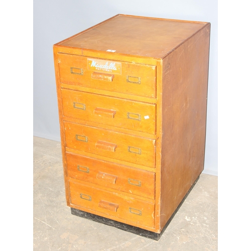 8 - A retro 5 drawer light oak chest of drawers with Maudella Patterns advertising decals, approx 54cm w... 