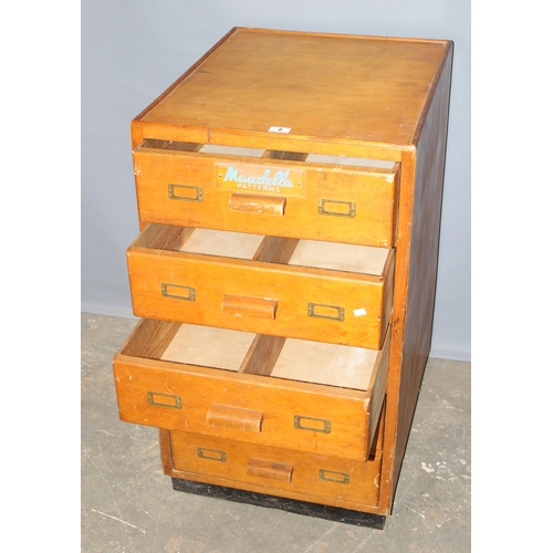 8 - A retro 5 drawer light oak chest of drawers with Maudella Patterns advertising decals, approx 54cm w... 