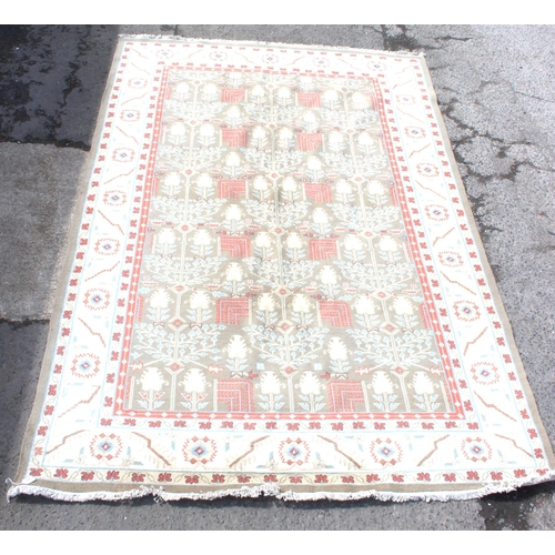 215 - Large cream ground rug with repeat floral decoration, measures approx 240cm 360cm