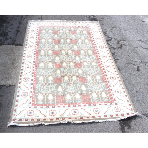 215 - Large cream ground rug with repeat floral decoration, measures approx 240cm 360cm