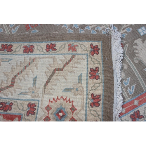 215 - Large cream ground rug with repeat floral decoration, measures approx 240cm 360cm