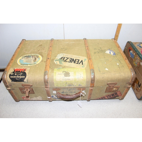 280 - 2 vintage canvas and wooden suitcases, both with a huge variety of vintage labels