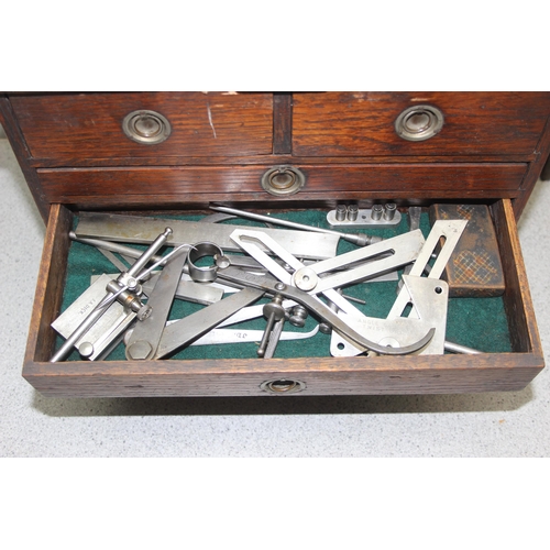 806 - An early 20th century oak engineers tool box and extensive contents