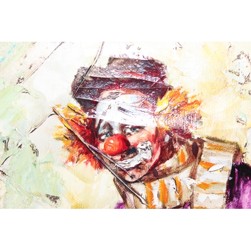 427 - A pair of mid-20th century oil on canvas clown paintings, both indistinctly signed J. Luna?, each in... 