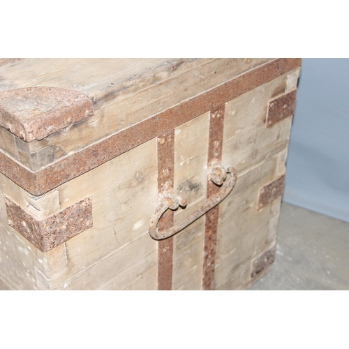 44 - An antique iron bound wooden trunk, strong box or silver chest, approx 107cm wide x 60cm deep x 66cm... 