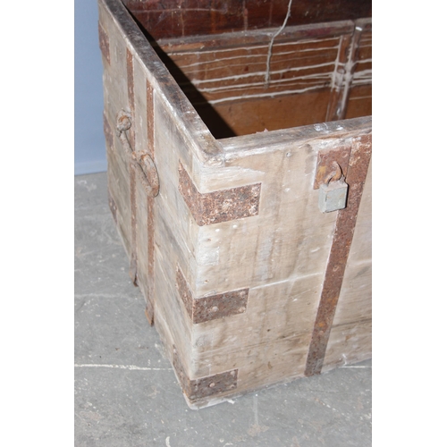 44 - An antique iron bound wooden trunk, strong box or silver chest, approx 107cm wide x 60cm deep x 66cm... 