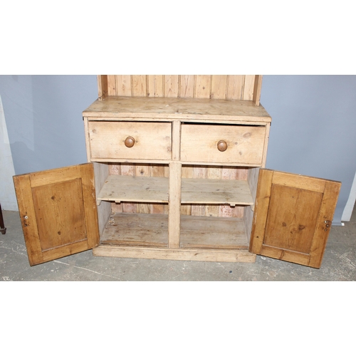 46 - A Victorian pine farmhouse kitchen dresser comprising of 2 drawers over 2 cupboards, approx 211cm ta... 