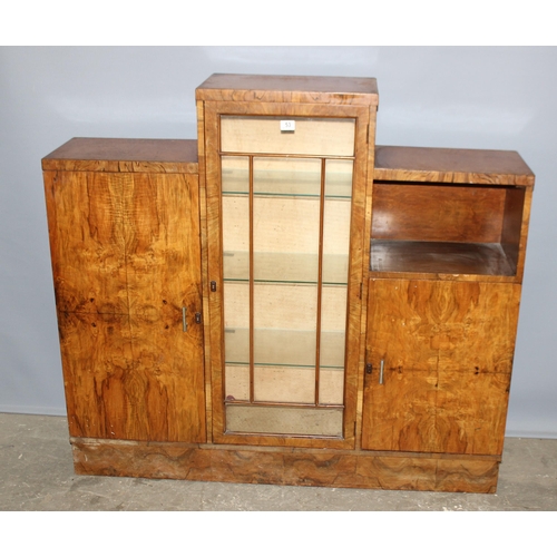 53 - An Art Deco period walnut display cabinet of unusual form, with key, approx 136cm wide