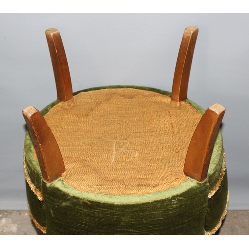 87 - A green velvet upholstered low chair