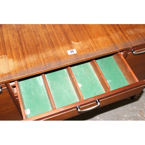 89 - A retro Meredew sideboard with 3 central drawers flanked by 2 cupboards, approx 166cm wide