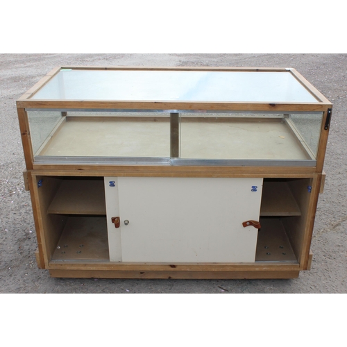 71 - A glazed pine counter display cabinet, approx 135cm wide x 98cm tall x 73cm deep