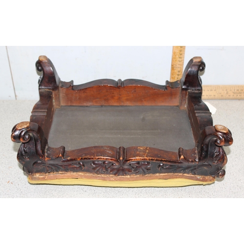 95 - An antique carved mahogany footstool in need of re-upholstery