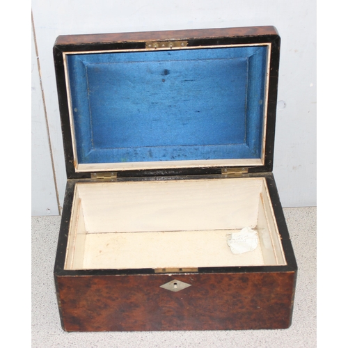 283 - An antique burrwood box with mother of pearl inlay