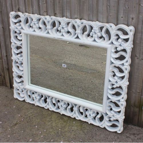 444 - A large decorative white framed mirror, approx 120cm x 95cm