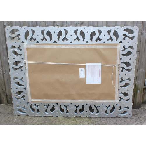 444 - A large decorative white framed mirror, approx 120cm x 95cm