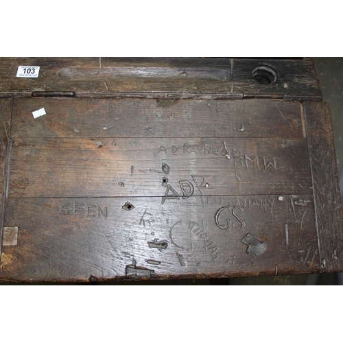 103 - An antique oak school desk with integrated seat, likely late 19th century, various interesting graff... 