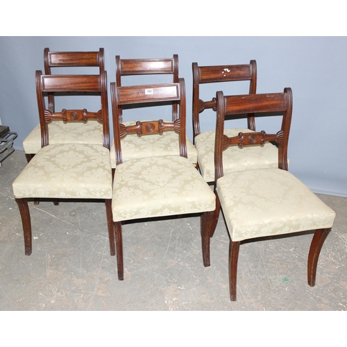 105 - A set of 6 antique mahogany rail back dining chairs standing on sabre legs with stuffed and upholste... 