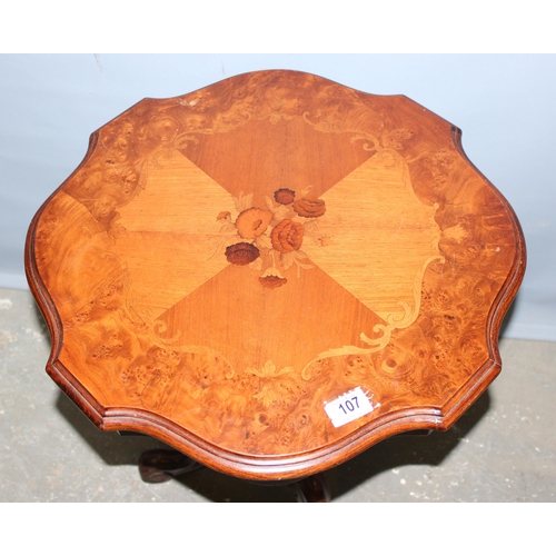 107 - A 20th century floral marquetry inlaid side table, the top approx 55cm in diameter