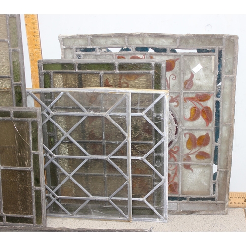 465 - 12 assorted antique and vintage leaded stained glass window panels, various sizes and designs