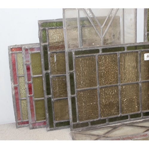 465 - 12 assorted antique and vintage leaded stained glass window panels, various sizes and designs