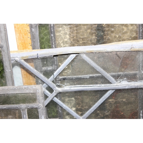 465 - 12 assorted antique and vintage leaded stained glass window panels, various sizes and designs