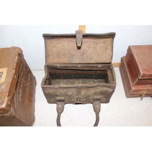 286 - A vintage travel trunk with labels, 2 small suitcases and a vintage leather and studded tool case