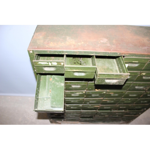 125 - A vintage 54 drawer set of green painted metal filing drawers, approx 92cm wide