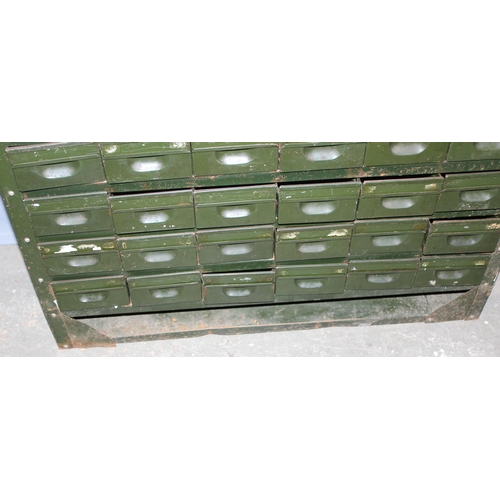 125 - A vintage 54 drawer set of green painted metal filing drawers, approx 92cm wide