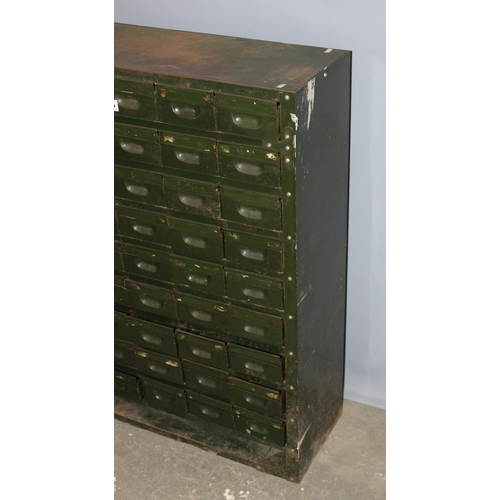 125 - A vintage 54 drawer set of green painted metal filing drawers, approx 92cm wide