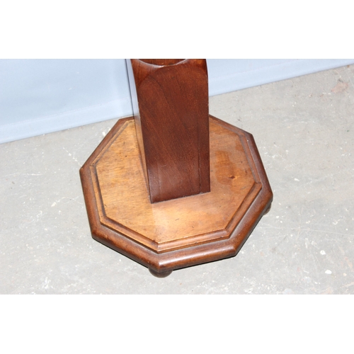 133 - A vintage carved wooden torchiere stand with octagonal top, approx 153cm tall