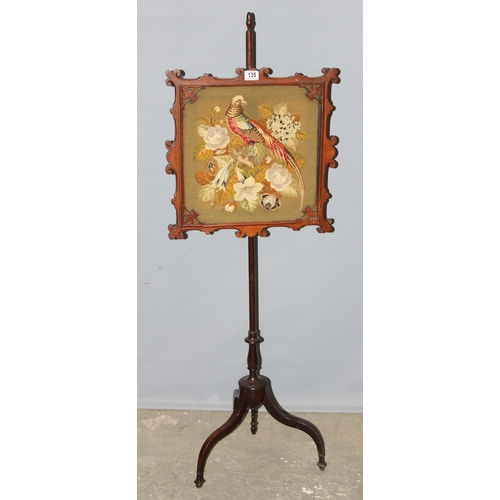 135 - An antique mahogany framed pole screen with tapestry panel depicting a pheasant in naturalistic sett... 